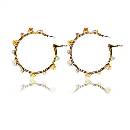 Golden hoop earrings transformed using Serinity beads in Opal White Shimmer and Brass Wire from Bluestreak Crystals
