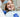 Lady in dentist chair having tooth gems applied