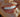 Lady smiling with white clean teeth and a tooth gem on one tooth