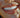 Lady smiling with white clean teeth and a tooth gem on one tooth