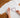 applying rhinestones to a white t-shirt