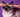 Cat wearing glasses embellished with rhinestones