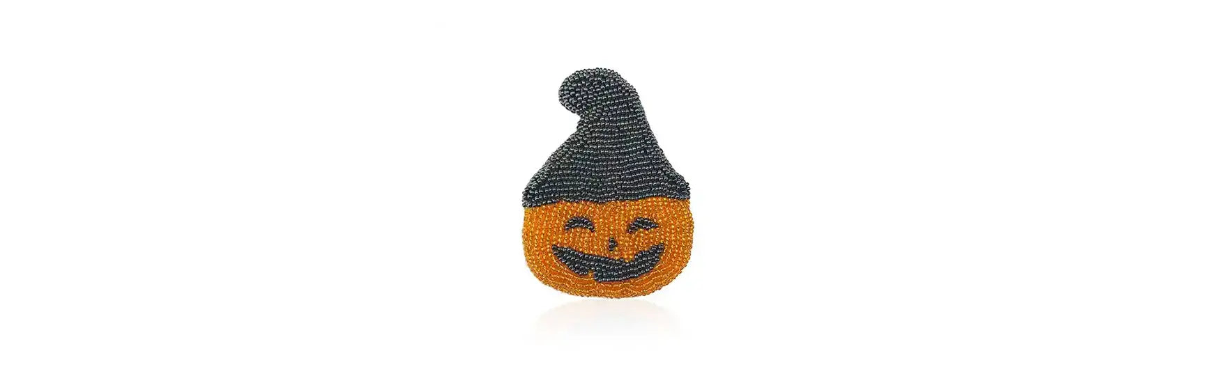 Halloween brooch of a pumpkin wearing a witch’s hat made of Preciosa Seed Beads