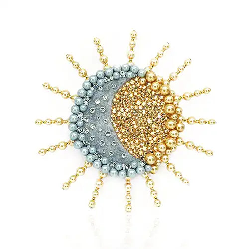 Sun and Moon motif brooch with gold Preciosa pearls and pearlescent grey pearls around the outside and Preciosa Crystals in the centre. 