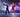 Ballroom couple in dancewear with rhinestone embellishments