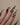 Stiletto nails with crystals in golden shadow colour