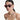 lady wearing Swarovski glasses, earrings, and many necklaces