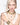 young lady with blonde hair wearing swarovski jewellery - bracelets, necklaces and earrings.