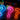 glowing neon question marks in blue, pink, and orange on a dark background, with smaller multicolored question marks floating above.