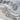 Decorative trim with rhinestones on a textured fabric background