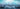 Open book with floating letters on a blurred classroom background