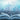 Open book with floating letters against a blue gradient background