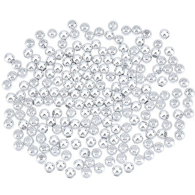 a pile of smooth round silver plated beads on a white background
